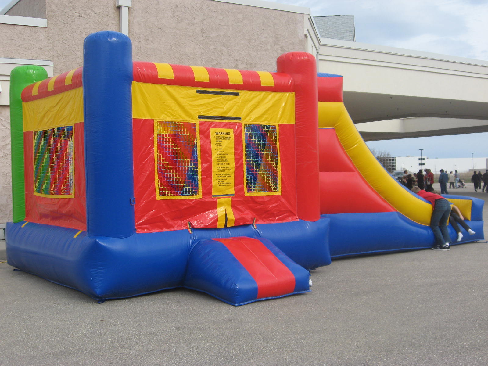 Inflatable bouncy castle and slide